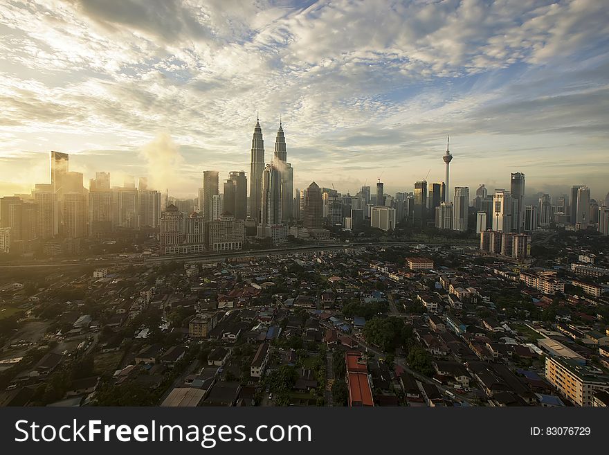 City High Under Cloudy Sky during Daytime