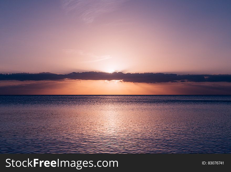 Calm Sea Under Blue Sky during Sunset