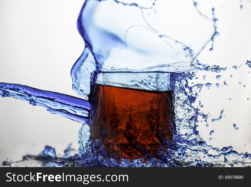 Blue Clear Glass Cup Splashed of Water