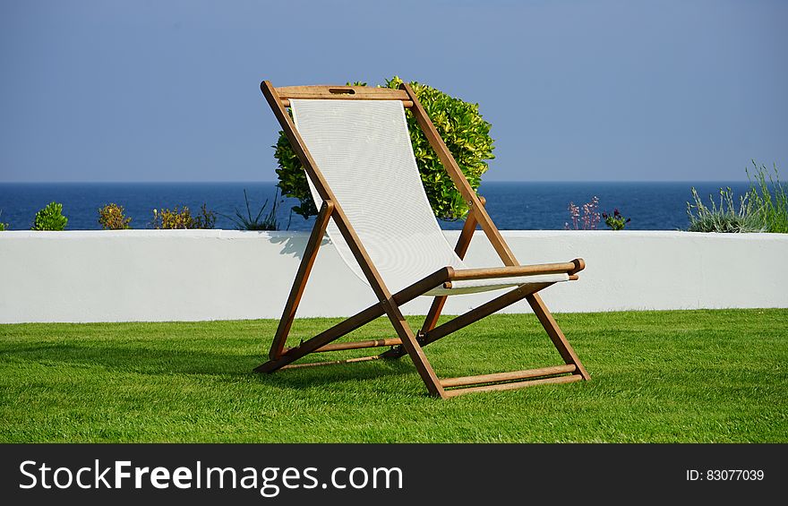 Brown And White Wooden Lounger