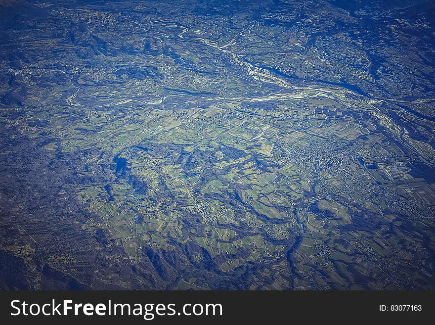 A bird's eye view over a green landscape. A bird's eye view over a green landscape.