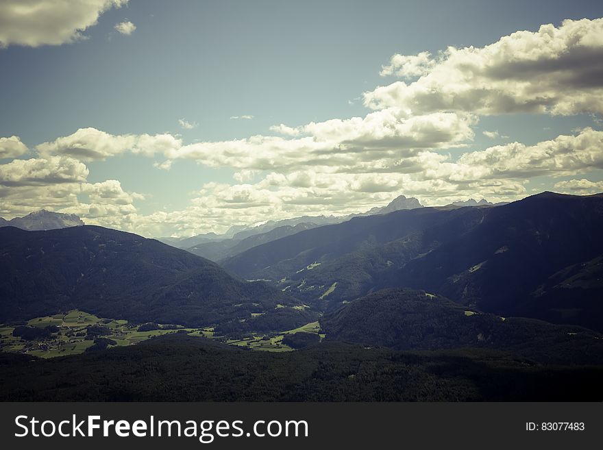 Black Mountain Range Under Gray Cloudy Sky during Daytime