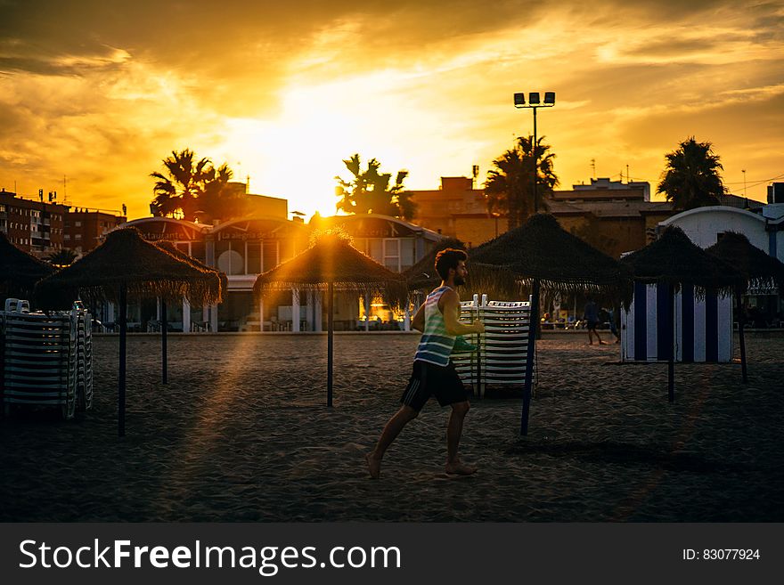 Man Running in the Beach during Sunset