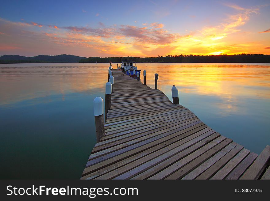 Wooden Dock At Sunset View