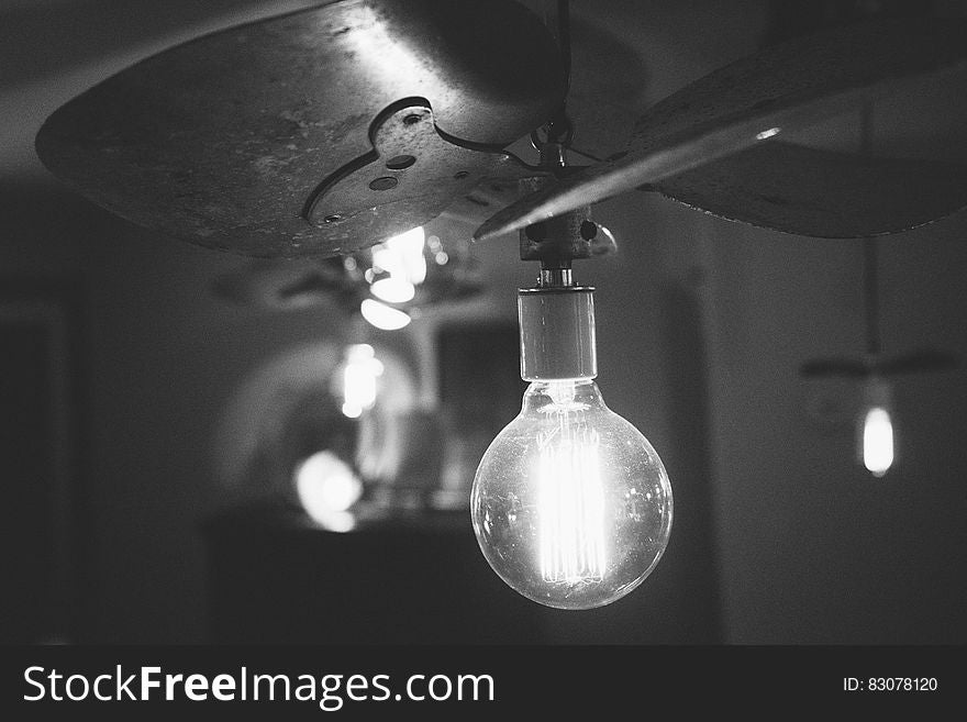 Light bulb illuminates dark room - idea concept