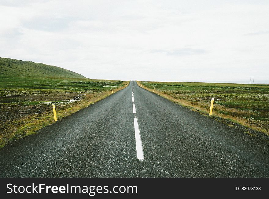 Straight asphalt road in the countryside receding into distance. Straight asphalt road in the countryside receding into distance.