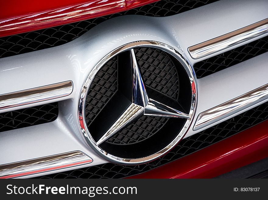 A closeup of the Mercedes logo. A closeup of the Mercedes logo.