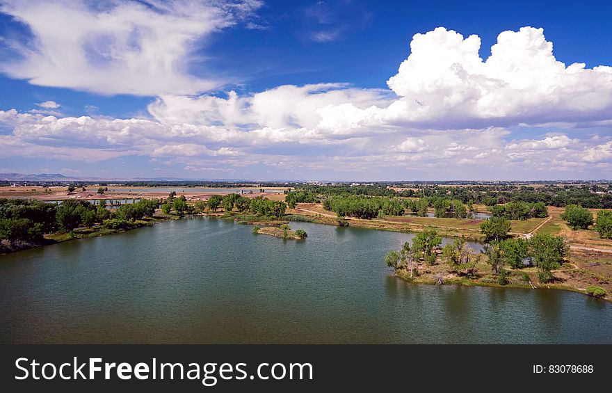 A panoramic view of a lake in the countryside. A panoramic view of a lake in the countryside.