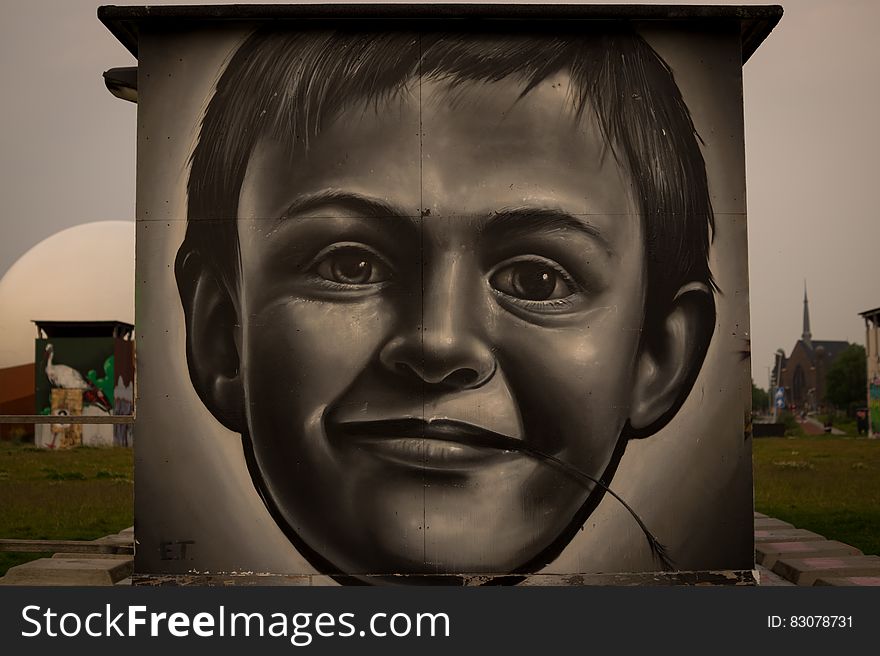 A grafitti depicting the face of a small boy. A grafitti depicting the face of a small boy