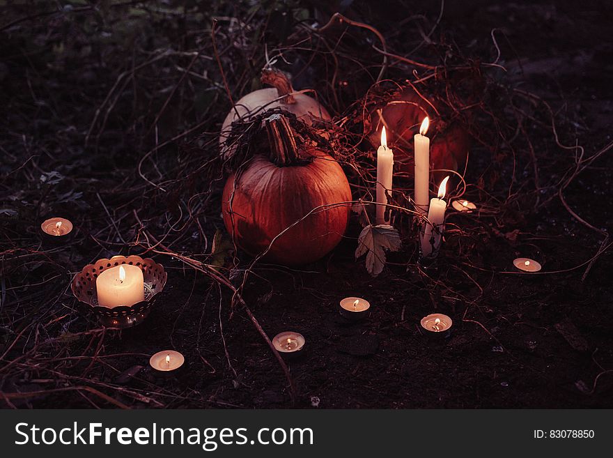 Jack O Lantern Beside Candles Halloween Decor