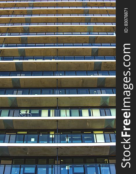 Facade view of an apartment building with balconies.