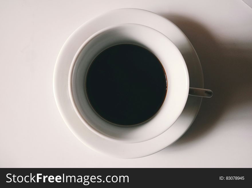 Black Liquid in White Ceramic Mug