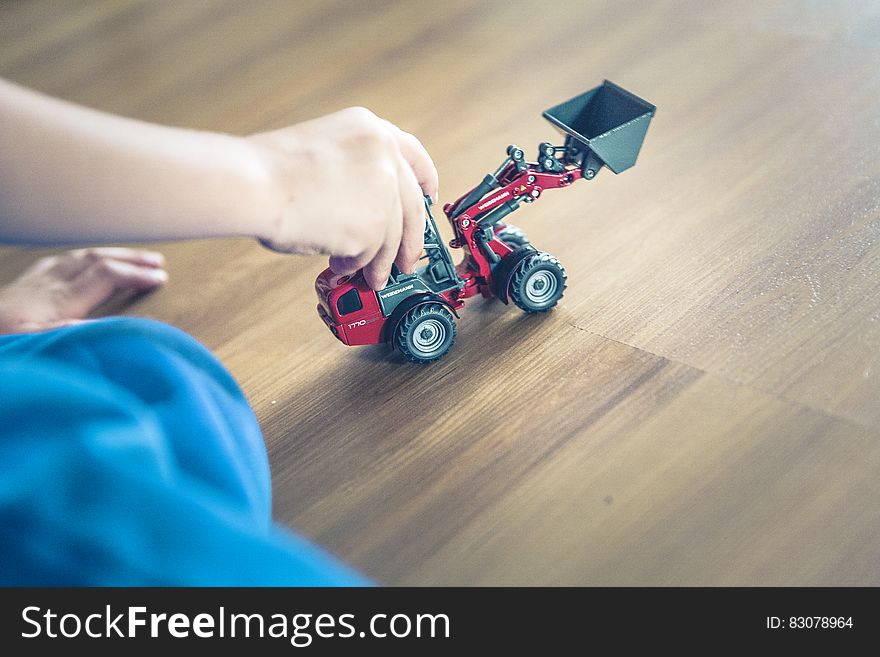 Child Playing Front Loader Toy