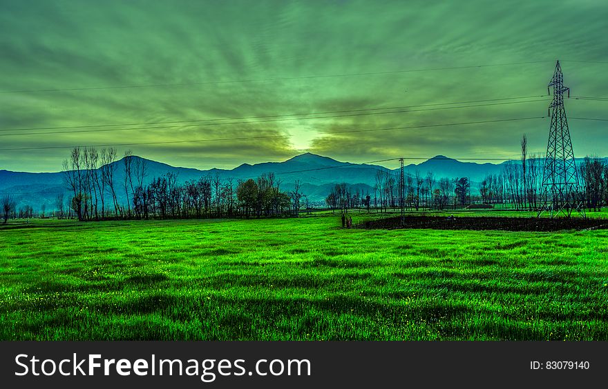 Silhouette Photography Of Mountain Near Green Grass