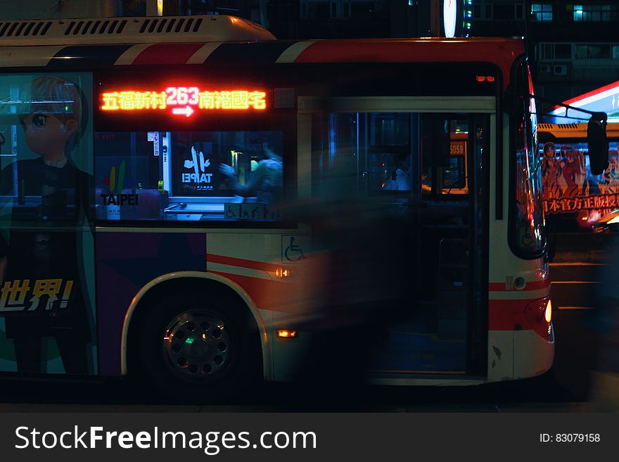 Silver City Bus on a City Street at Night