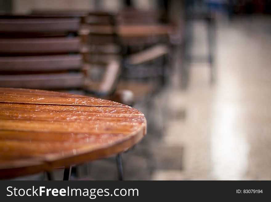 Rain drops on restaurant table on outdoor terrace. Rain drops on restaurant table on outdoor terrace