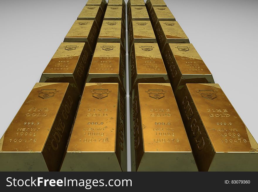 Shallow Focus Photo of Gold Bars