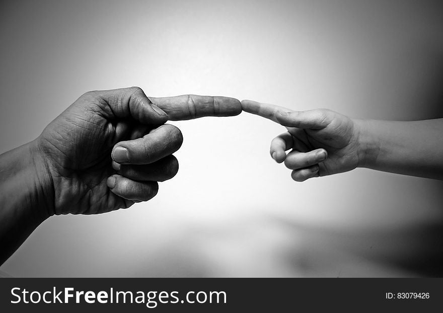Grayscale Photo of Human Aligning Fingers