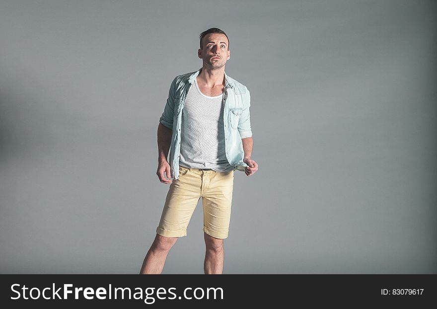 Young man looking up in studio