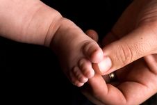 Baby Foot And Big Hand Royalty Free Stock Image