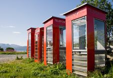 Four Old Telephone Boxes On Non-urban Background Stock Images Four Old Telephone Boxes On Non-urban Background Stock Images