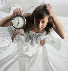 Woman With Alarm Clock Royalty Free Stock Images