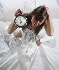 Woman With Alarm Clock Stock Photography