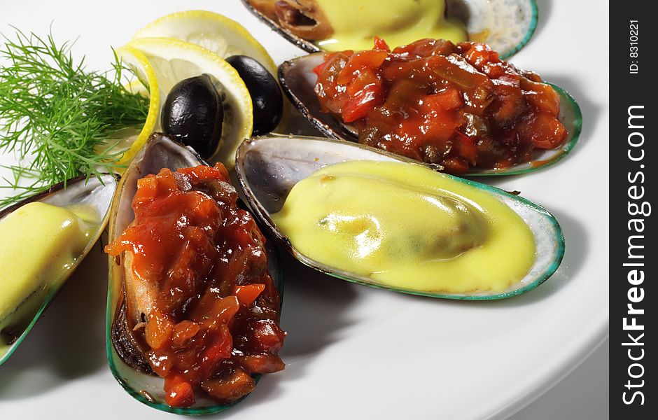 Cooked Mussels on a Plate Served with Lemon and Dill. Cooked Mussels on a Plate Served with Lemon and Dill