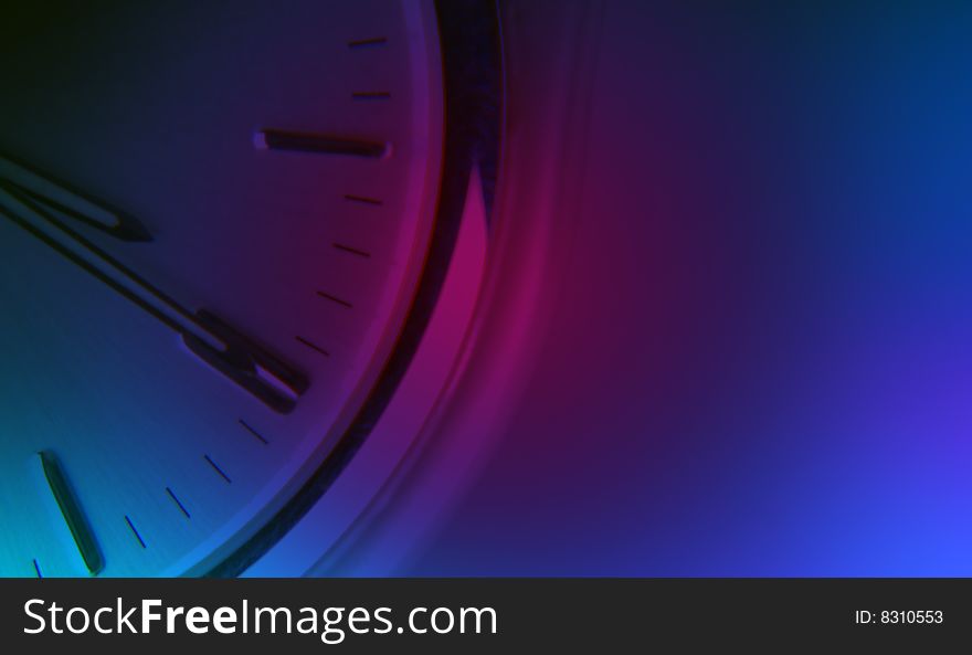 Watch face overlaid with blue and purple lighting. Watch face overlaid with blue and purple lighting