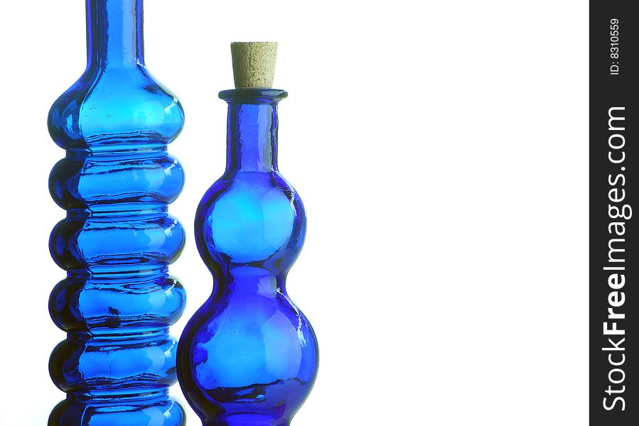 Two decorative blue bottles on white background