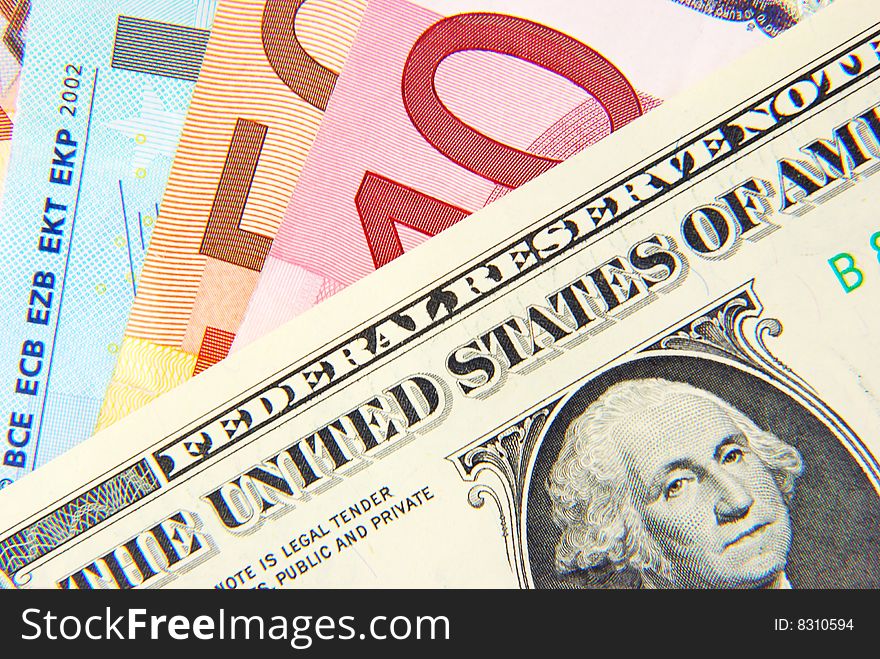 American dollar and European euro bank notes. American dollar and European euro bank notes