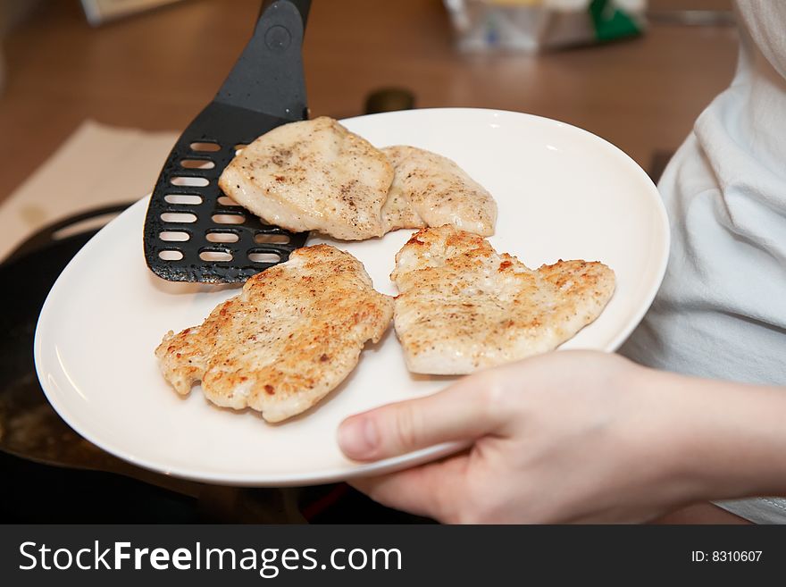Chicken cutlets on a plate, shallow DOF