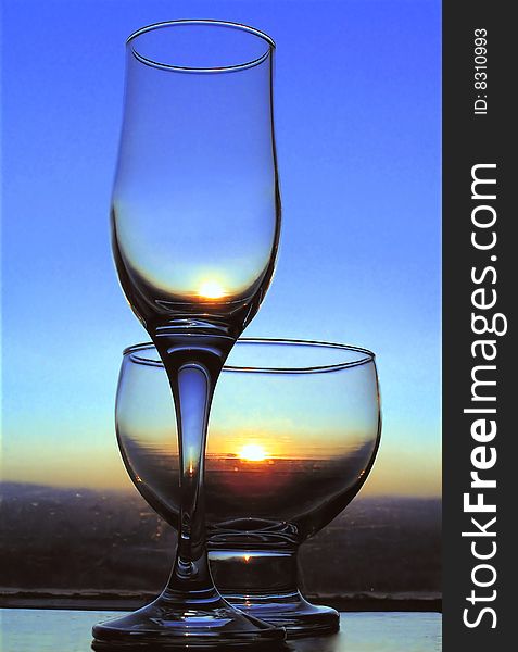 glasses with the sun at sunset background. glasses with the sun at sunset background