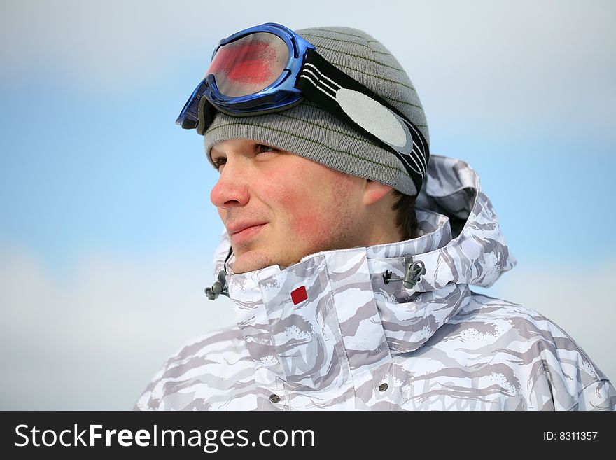 Snowboarder portrait. Winter day photo.