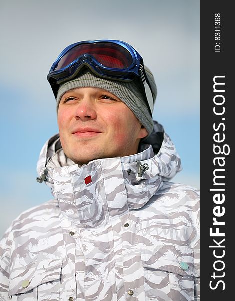 Snowboarder portrait. Winter day photo.