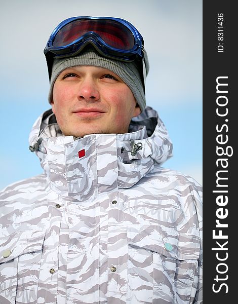 Snowboarder portrait. Winter day photo.