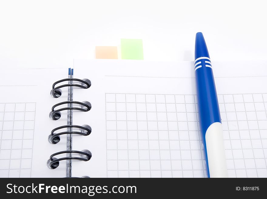 Blank notebook with pen on white background