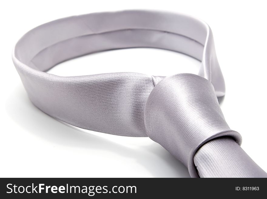 Gray fashionable metallic necktie isolated over white. Gray fashionable metallic necktie isolated over white