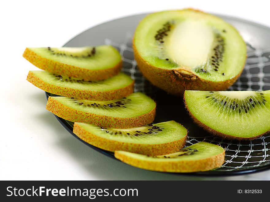 Slice fresh kiwi on plate