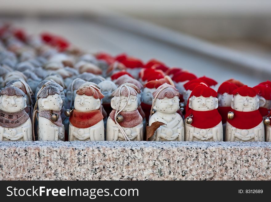 Row of Buddhist statues in a Japanese temple. Selective focus. Row of Buddhist statues in a Japanese temple. Selective focus.