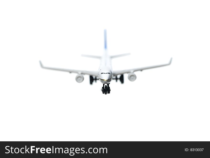Toy airplane towards white background