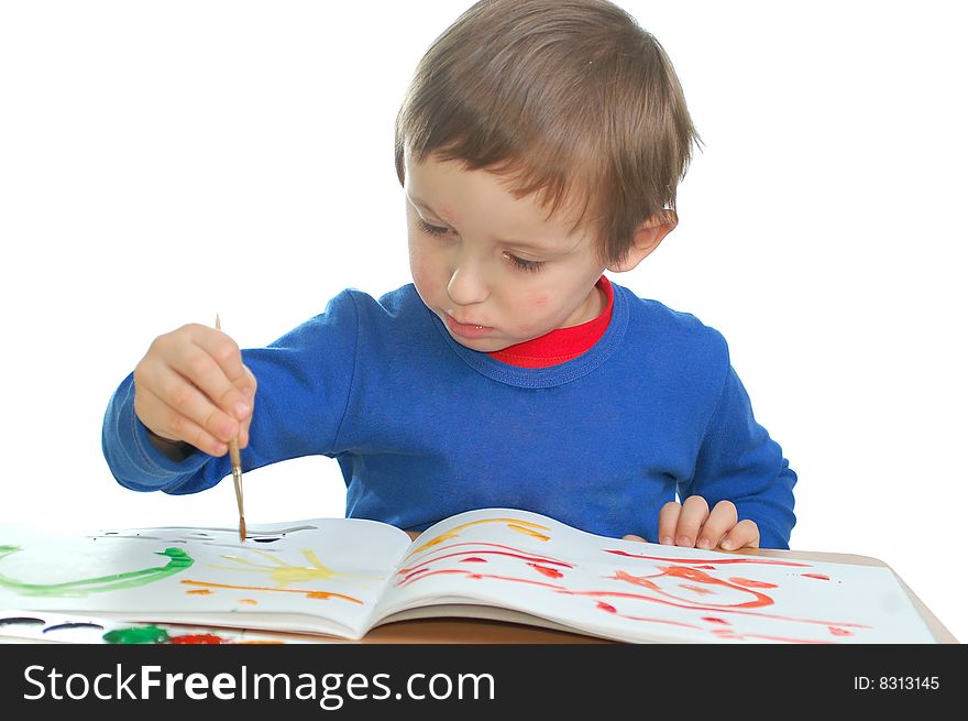 Cute child drawing with the brush