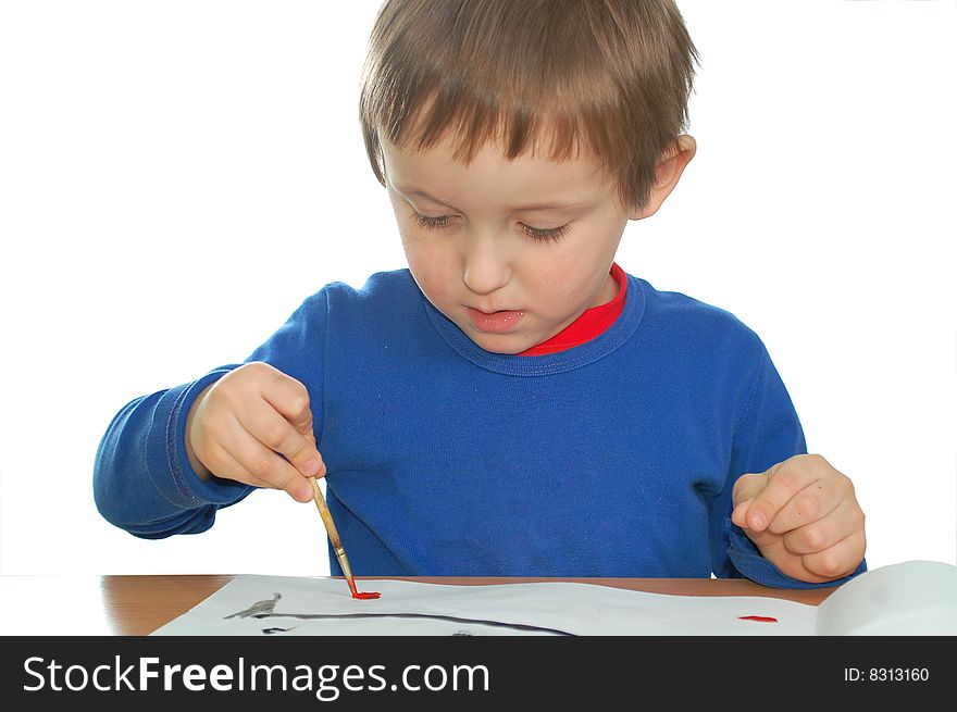 Cute child drawing with brush