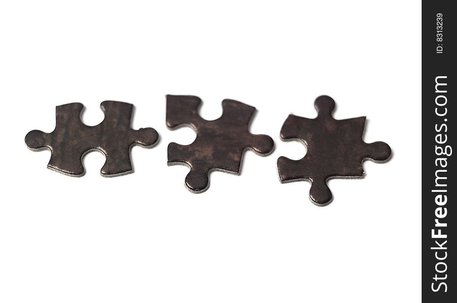 Pieces of a puzzle towards white background