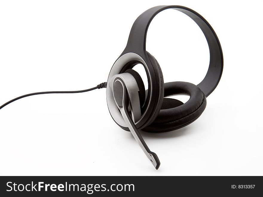 A black stereo headset isolated on a white background