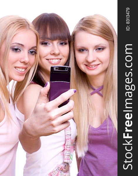 Three girls with phone on a white background