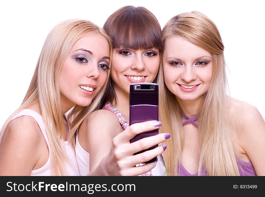Three girls with phone on a white background