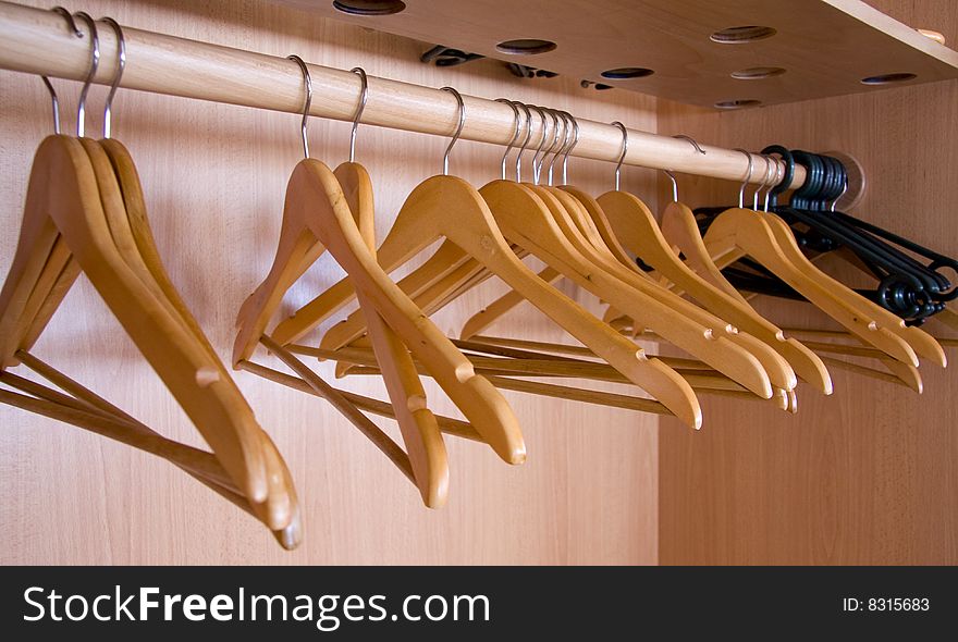 Wooden coat hangers, concept of clothing and fashion.