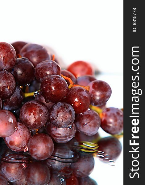 Cluster of pink grape isolated on white background