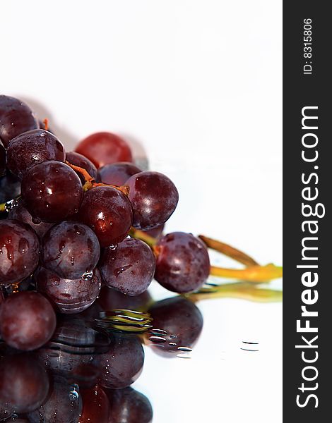 Cluster of pink grape isolated on white background